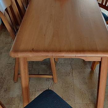 Light oak dining table with 6 chairs, still in good condition