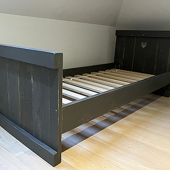 Single bed made of scaffolding wood
