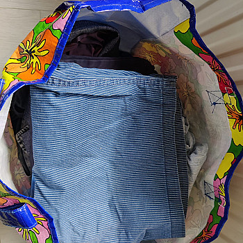 Bag with men&#39;s clothing in different sizes