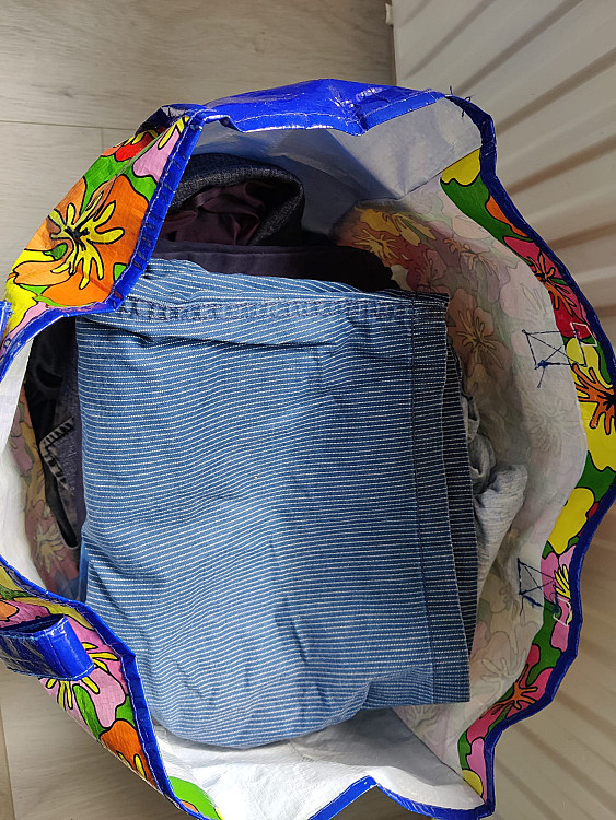 Bag with men&#39;s clothing in different sizes