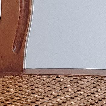 Vintage chair with woven seat and armrests